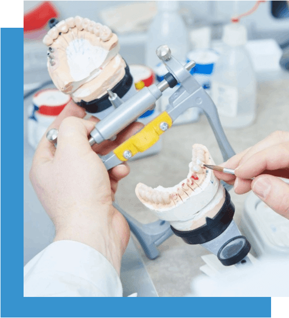 A person is working on an artificial teeth.